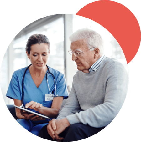 A nurse talking to a patient.